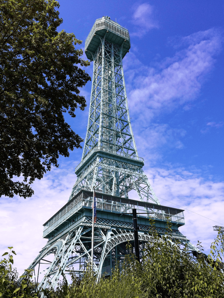 Kings Island Eiffel Tower replica against blue sky